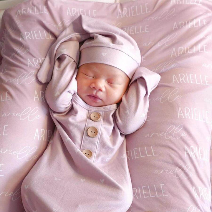personalized petal pink baby name swaddle blanket block and script 