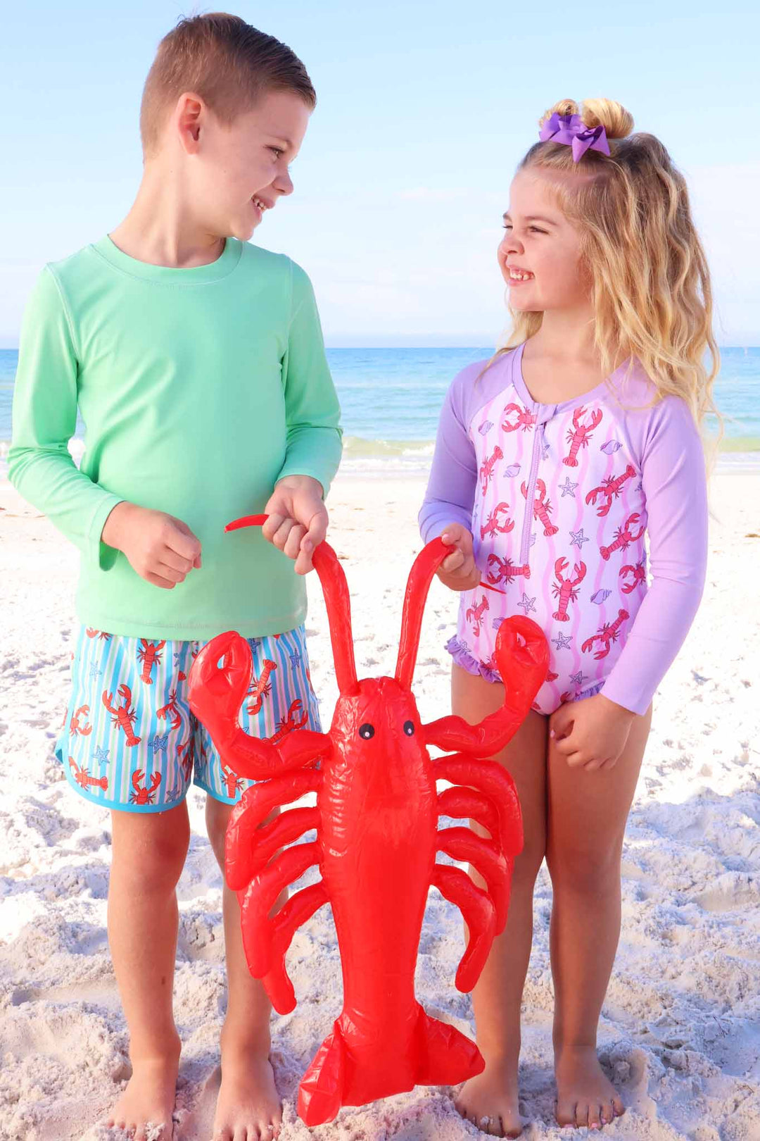 brother and sister matching lobster swimsuits 