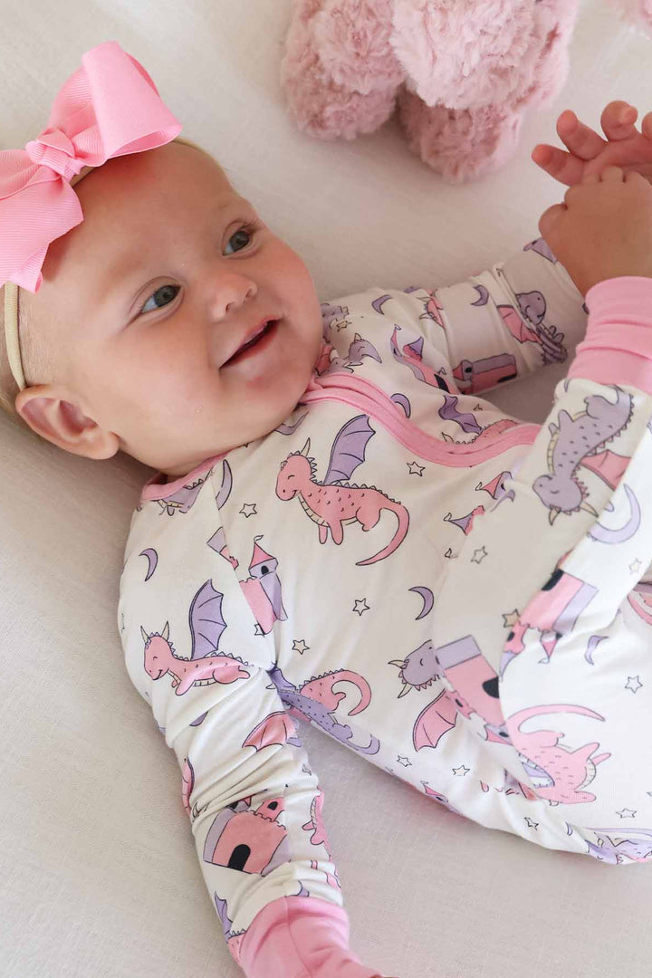 pink and purple dragon and castle convertible zip romper for girls with pink ribbon bow headband 