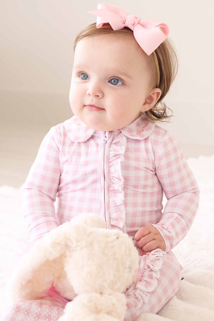 pastel pink gingham print footie pajamas with peter pan collar and lace trim for girls