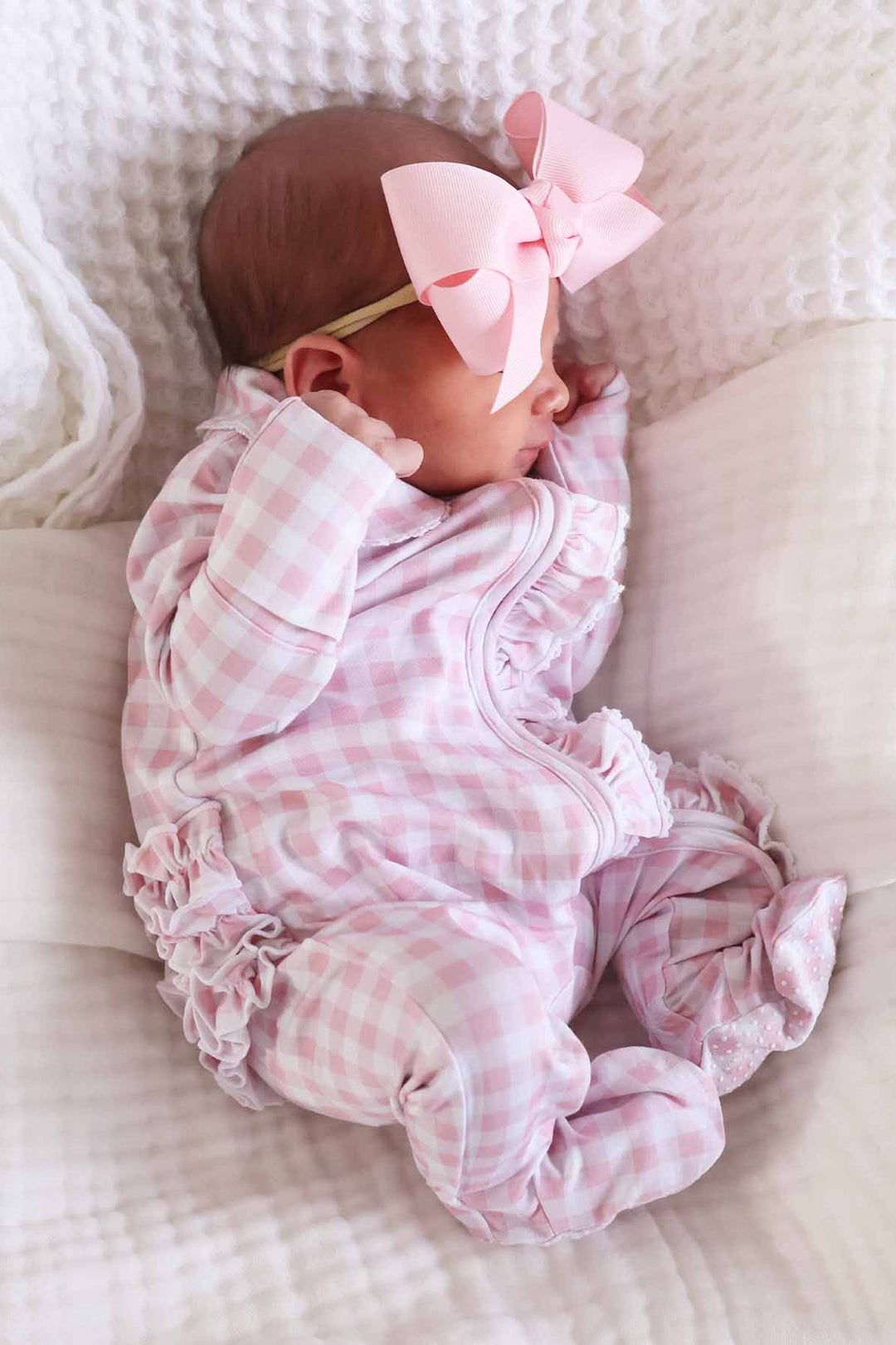 pink gingham print footie pajamas with 
ruffles for baby girls