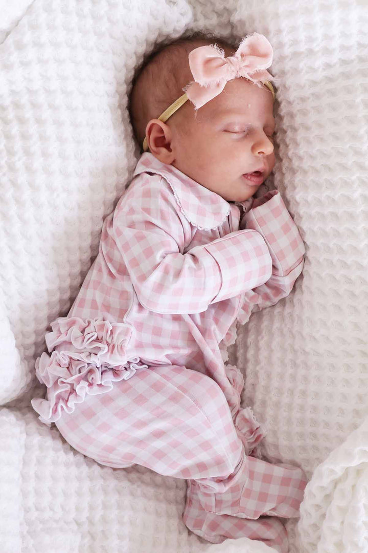 pink gingham print footie pajamas with 
ruffles for baby girls