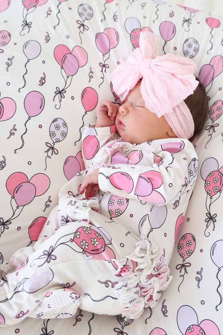 pink and purple balloon party themed footie pajama with ruffles for girls 