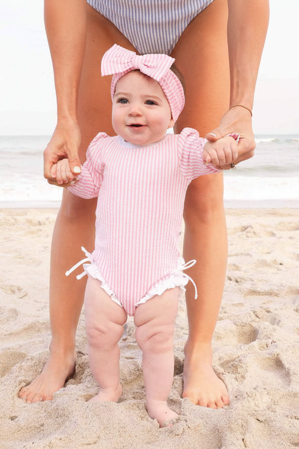 girls' long sleeve seersucker rash guard with ruffle bottom in soft pink