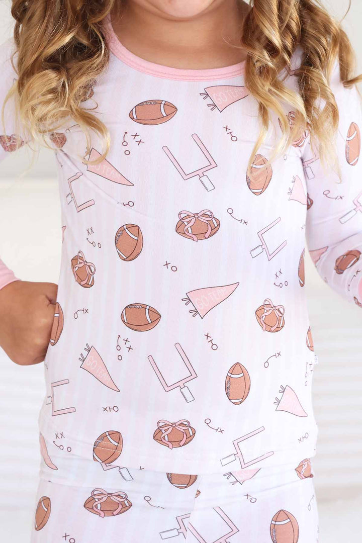 pink tiny touchdown two piece pajama set for kids 