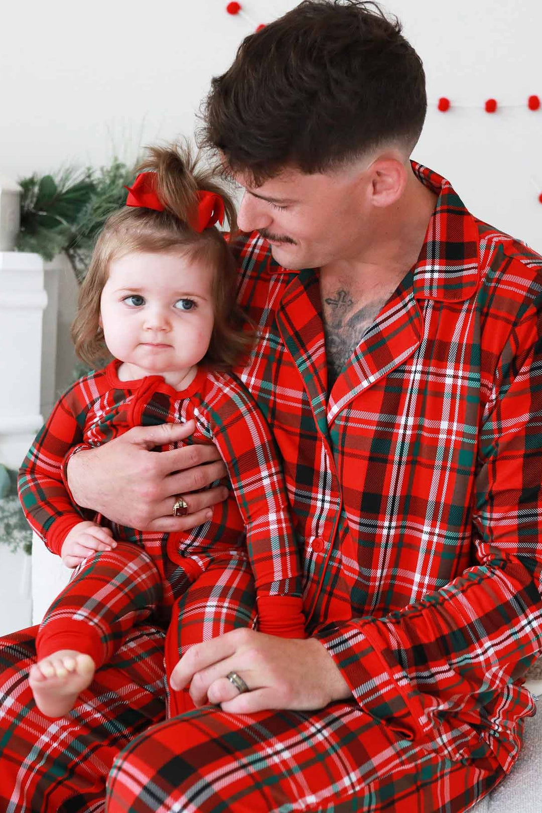 Father and daughter in matching plaid Caden Lane pajamas