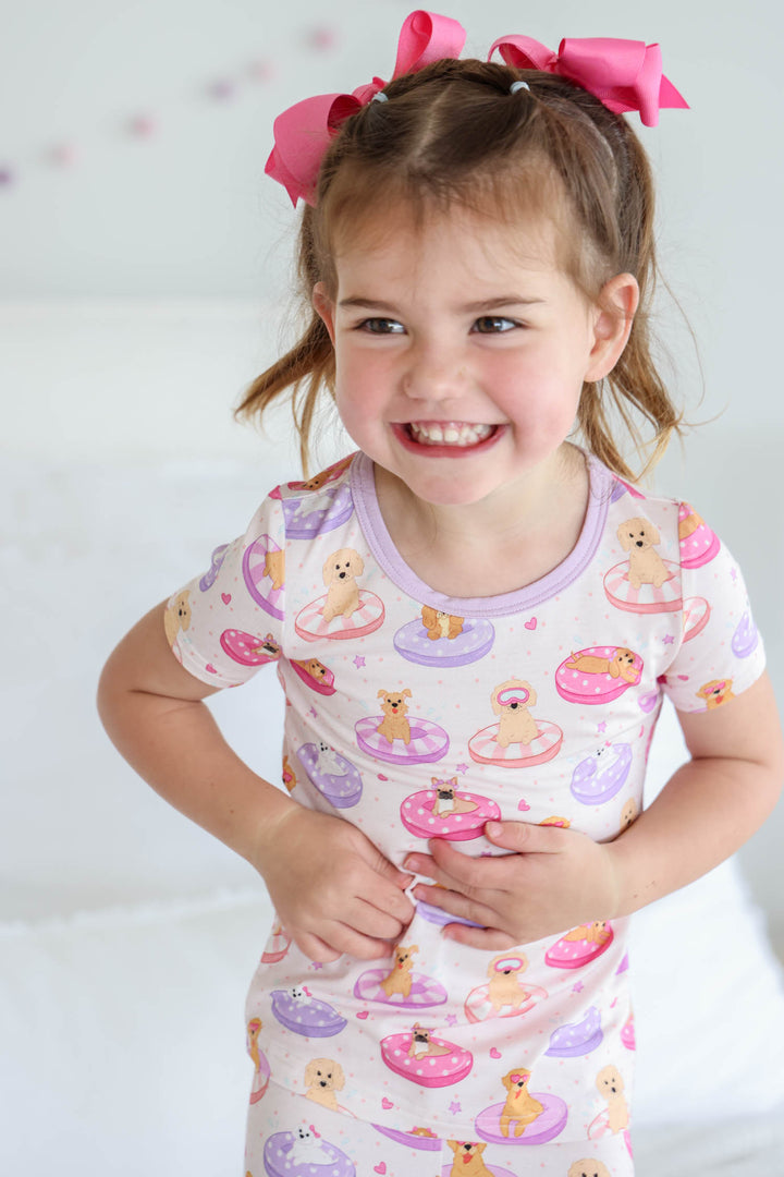 smiling girl in poolside pups two piece short sleeve and short pajama set