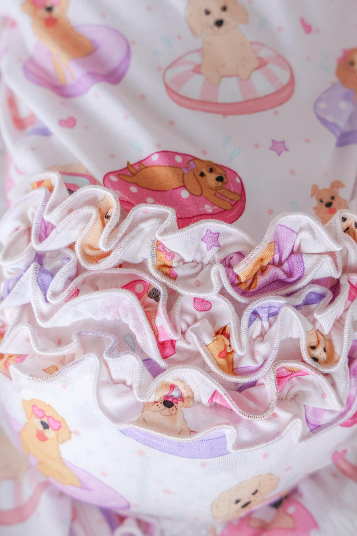 closeup of poolside pups pink ruffle zipper footie