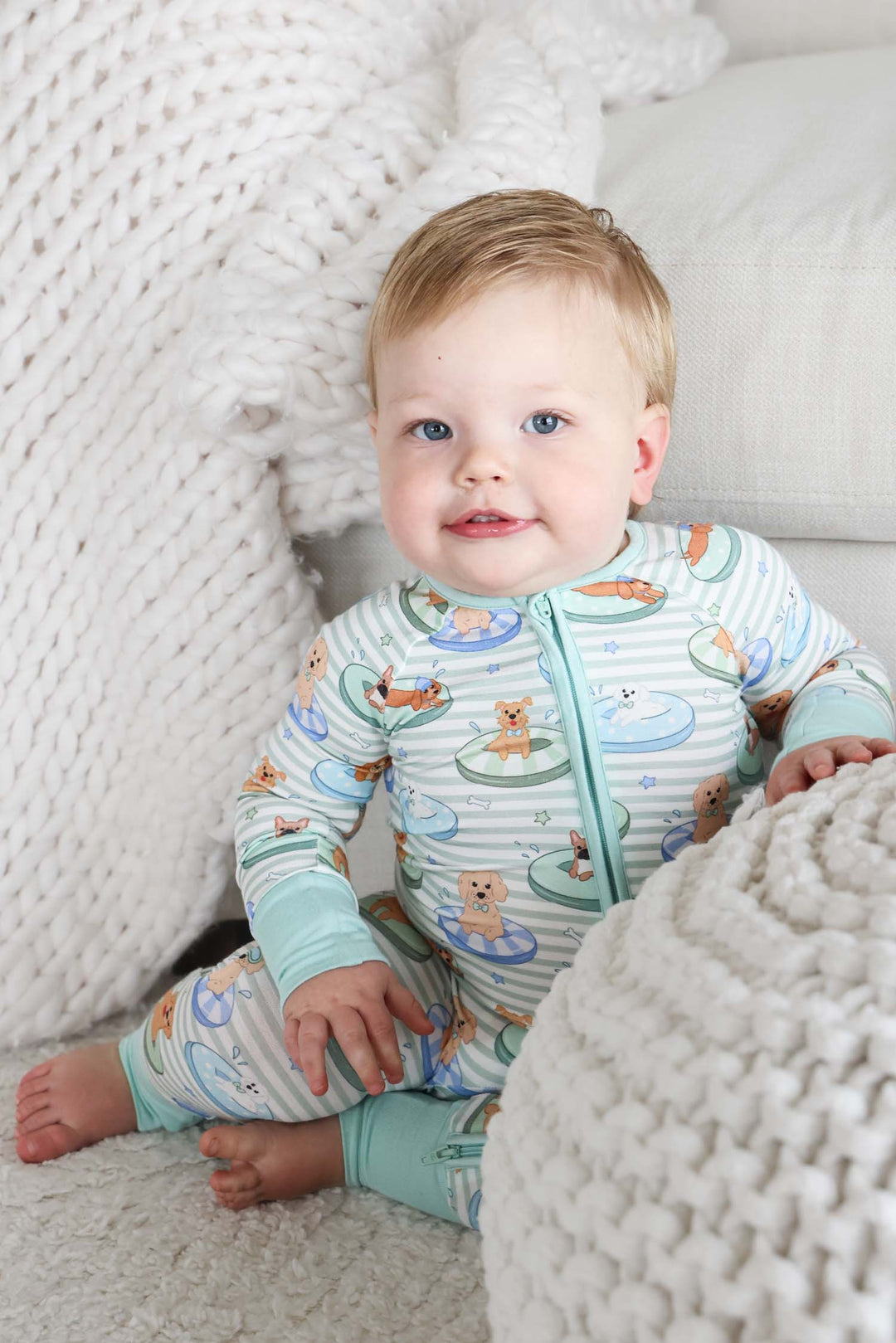 green stripes pajama romper with dogs on pool floaties
