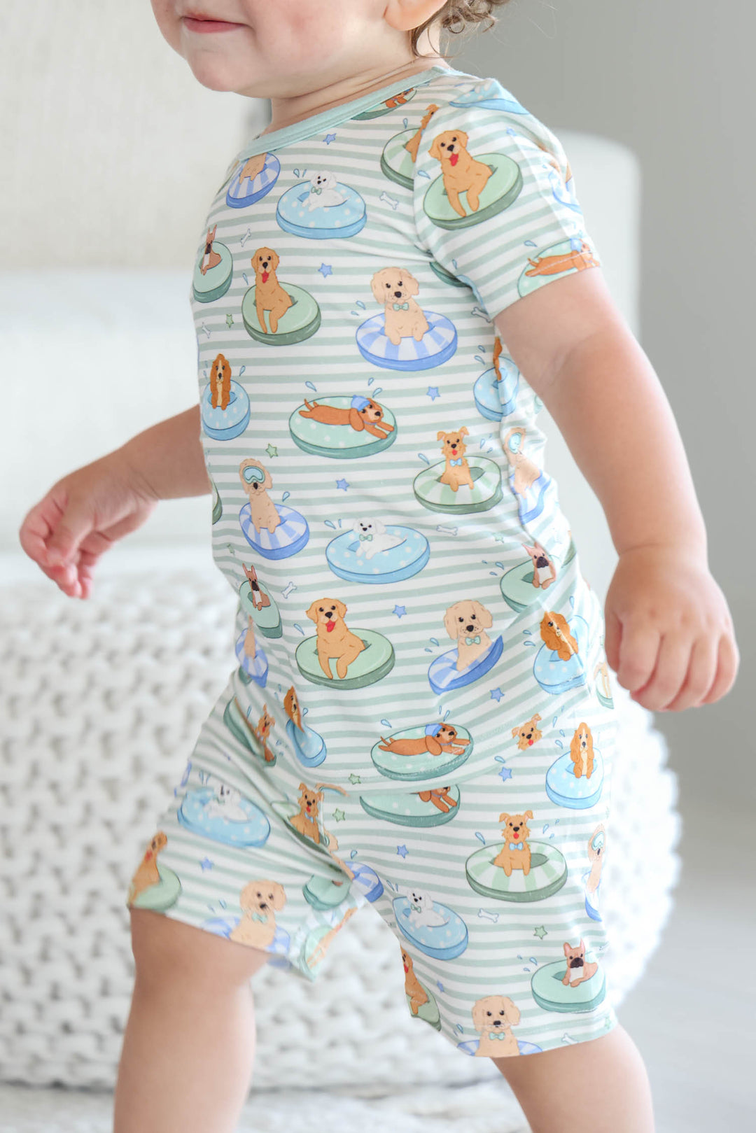 boy walking in poolside pups blue two piece pajama set