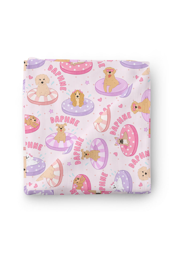 Poolside Pups Pink swaddle flat lay