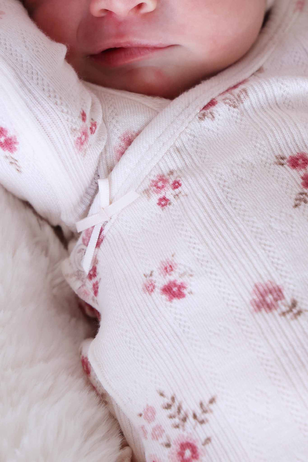 closeup of precious posies crossover set with tiny bow