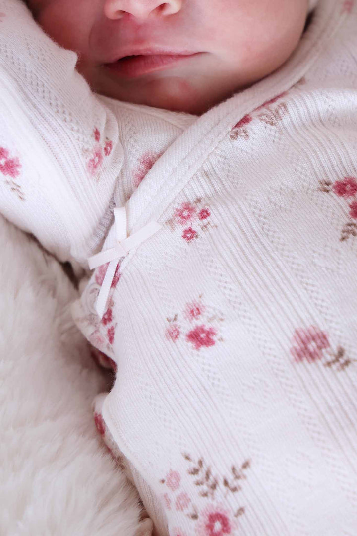 closeup of precious posies crossover set with tiny bow