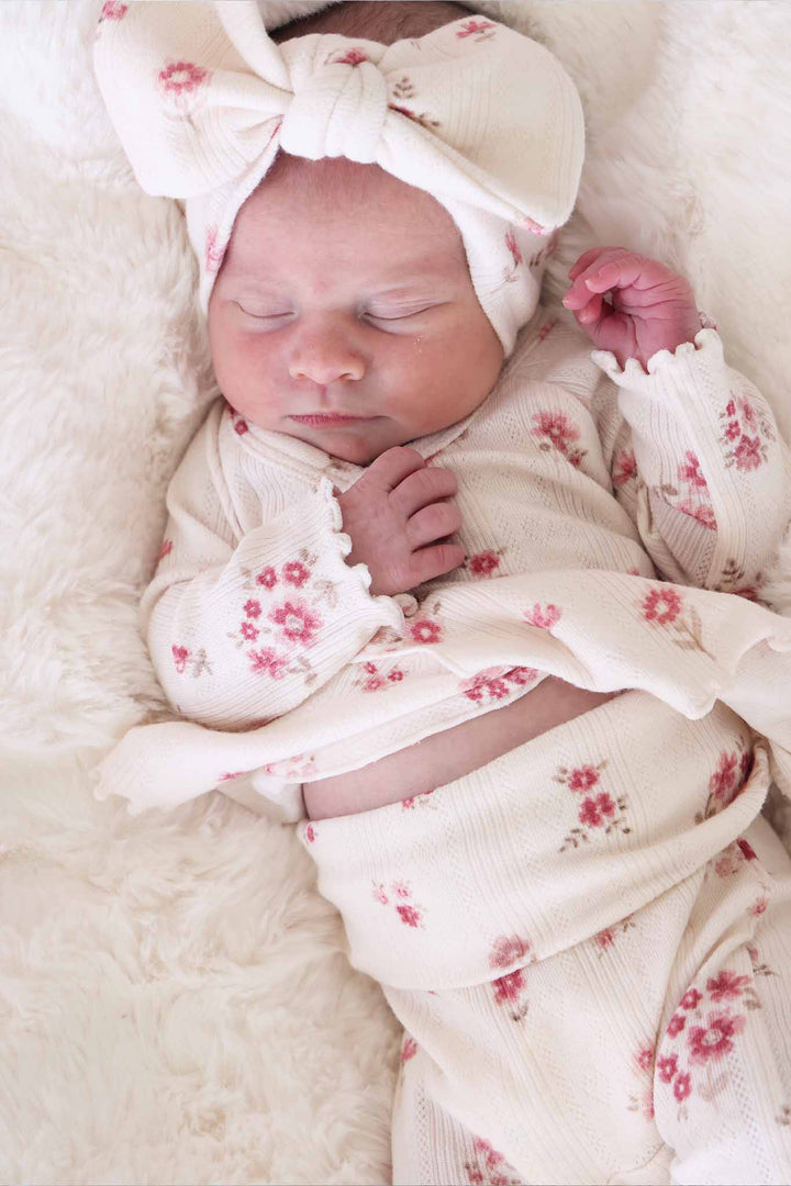 closeup of precious posies 2pc pointelle crossover set with matching headwrap 