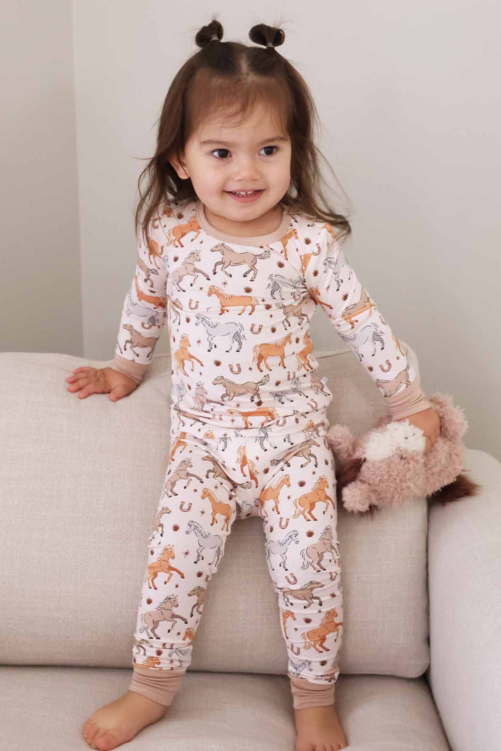 girl's two piece pajama set with ponies and horses print - caden lane