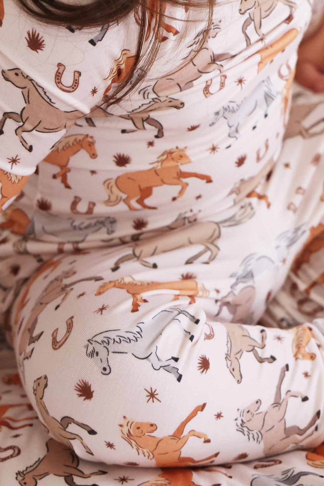 kids pajama set with horse and horseshoe print - caden lane