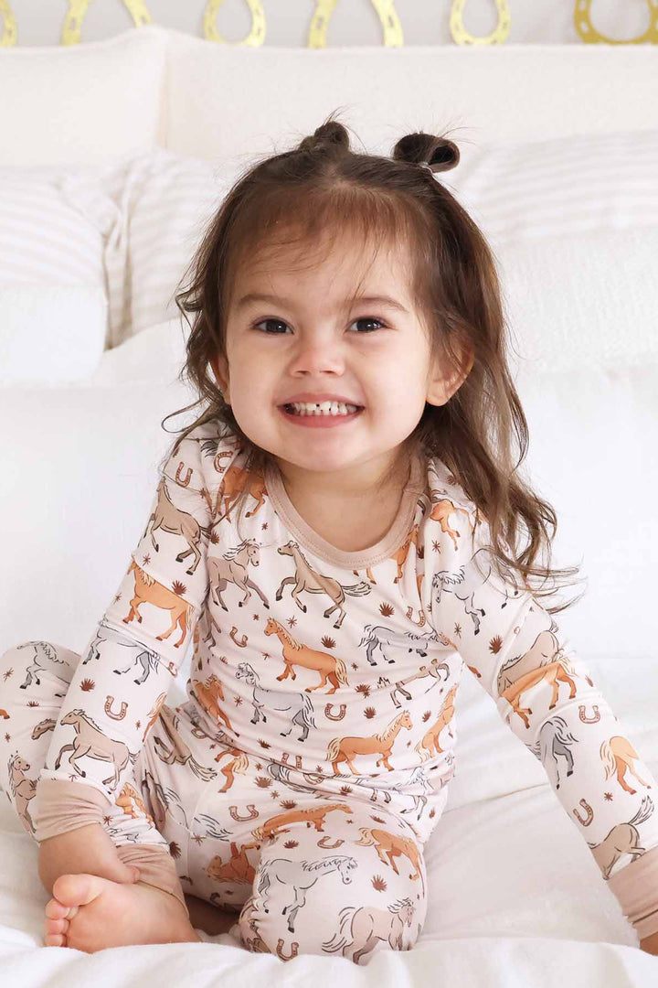 toddler girl pajama set with ponies and horses print - caden lane