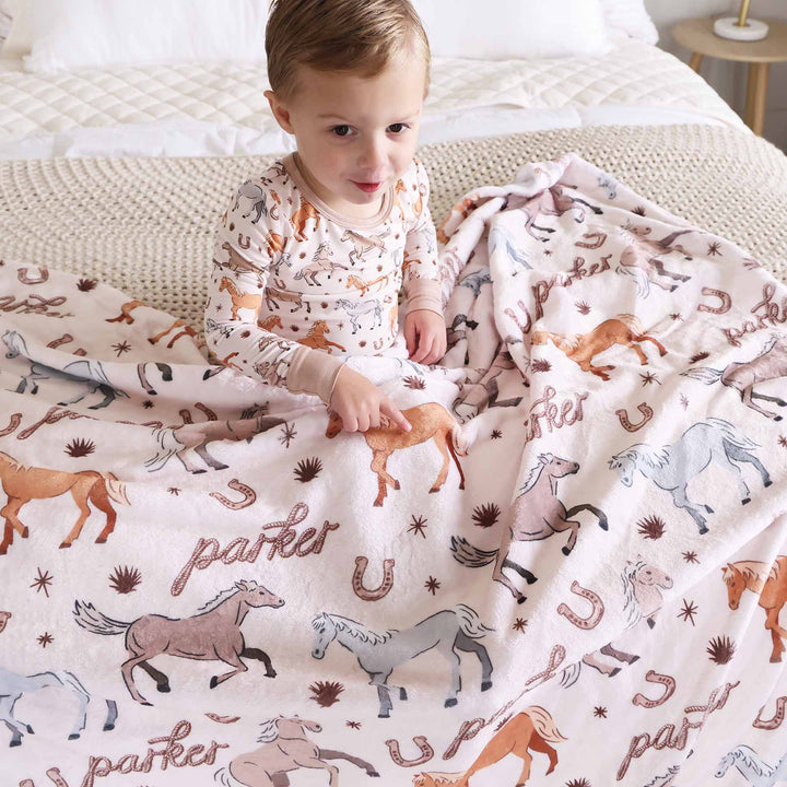 personalized kids blanket with ponies, horses, and horseshoes print - caden lane