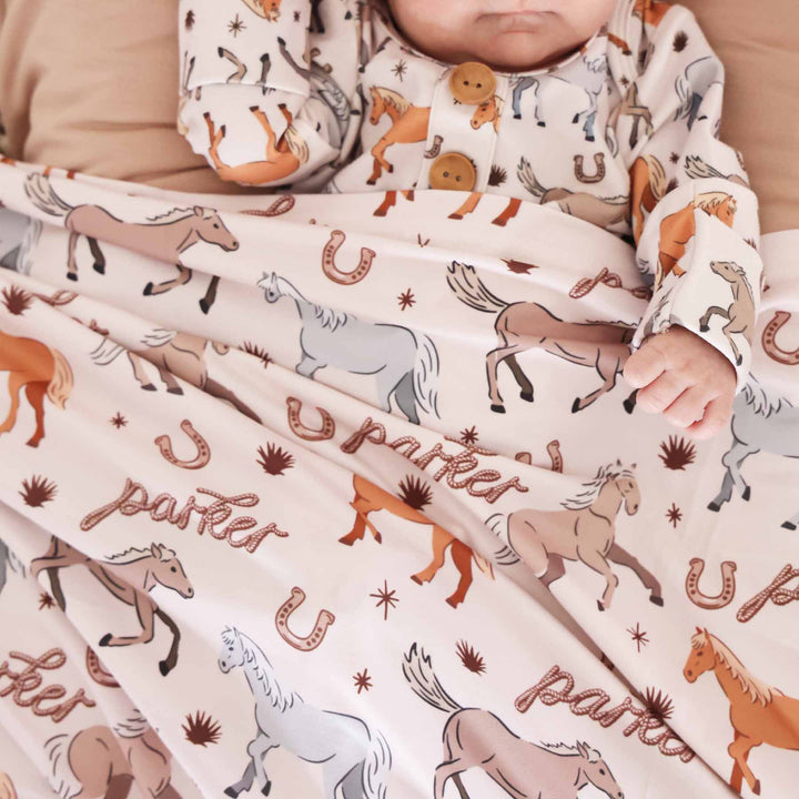 newborn personalized swaddle blanket with horse print - caden lane