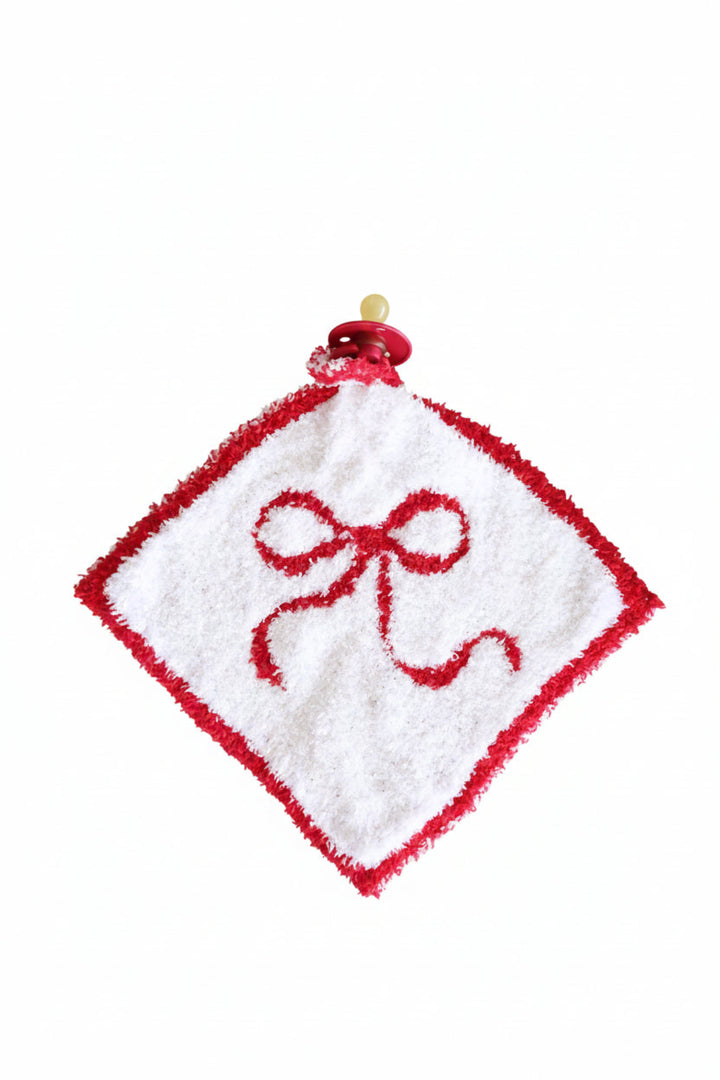 white lovey with red bow and red trim