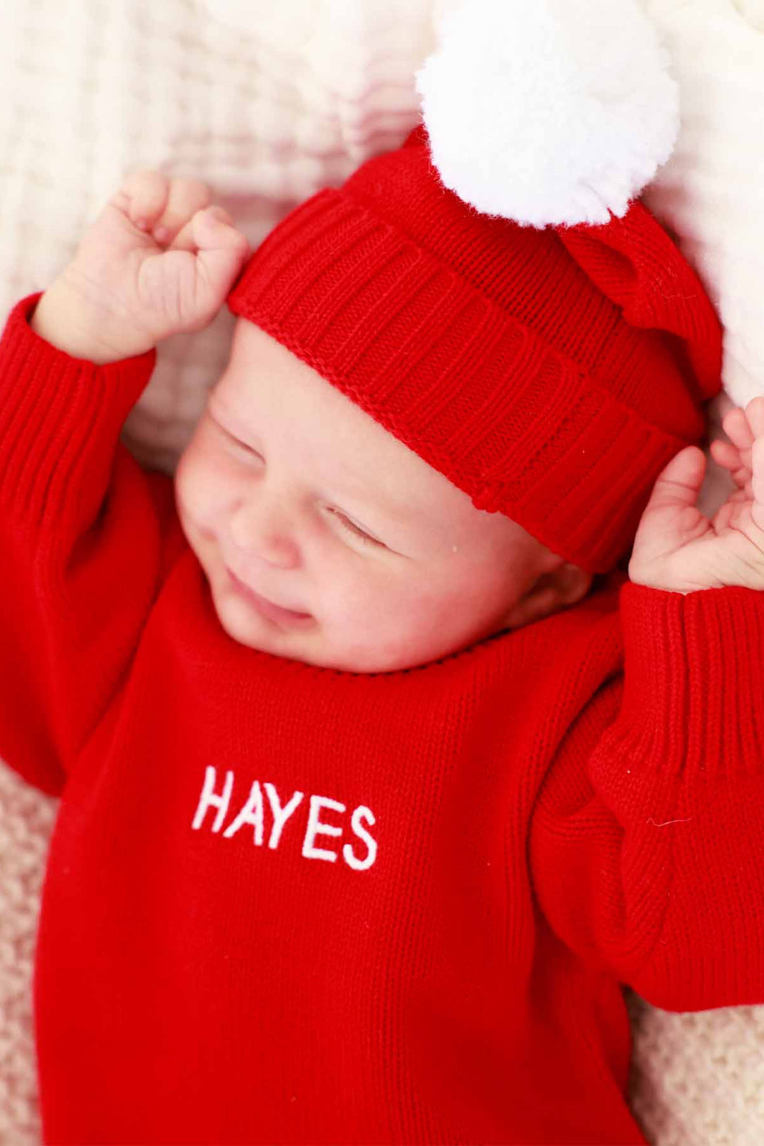 red personalized knit sweater bubble romper for babies with matching pom pom beanie 