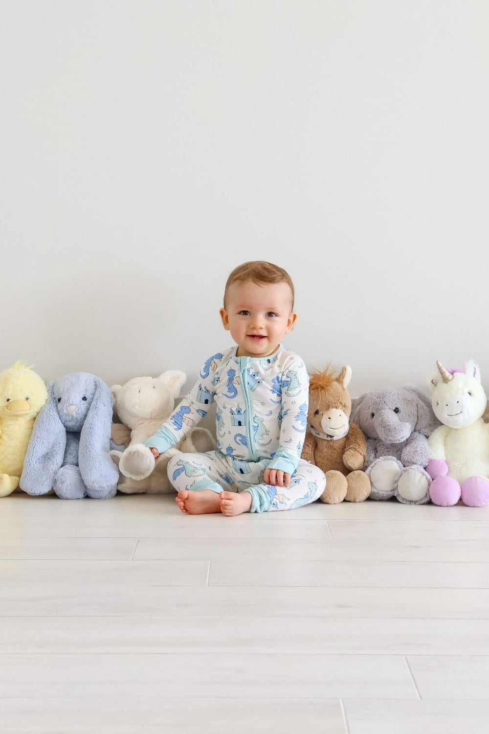 little  boy with stuffed animals