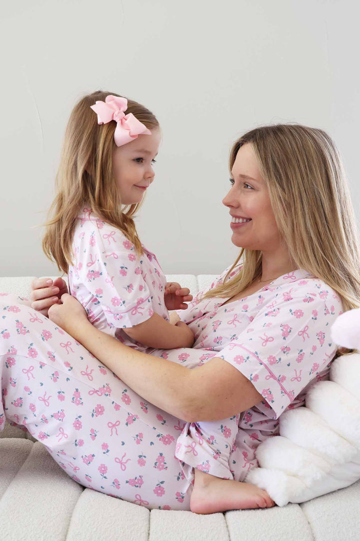 daughter sitting on mom in matching  ribbon and roses pink collared button up  lounge set 