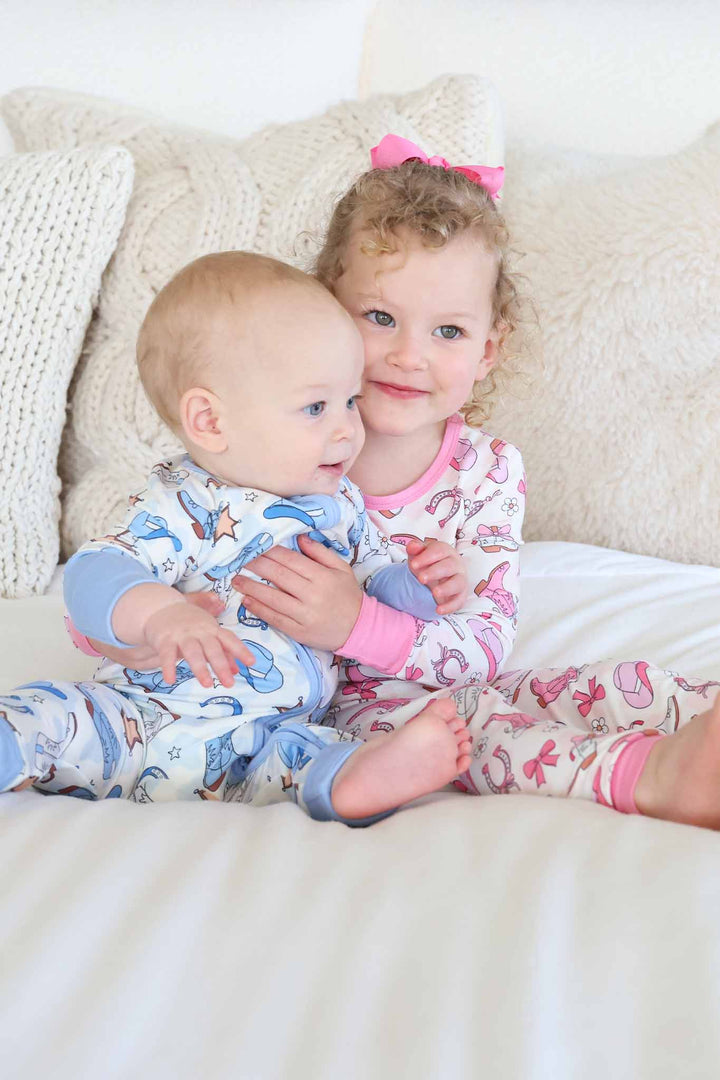 rodeo dreams sibling matching pajamas in blue and pink 