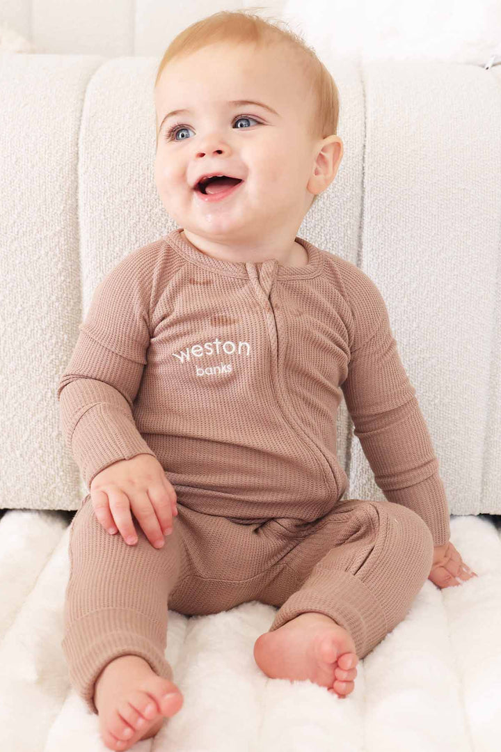 neutral brown convertible zip romper made of bamboo waffle 
