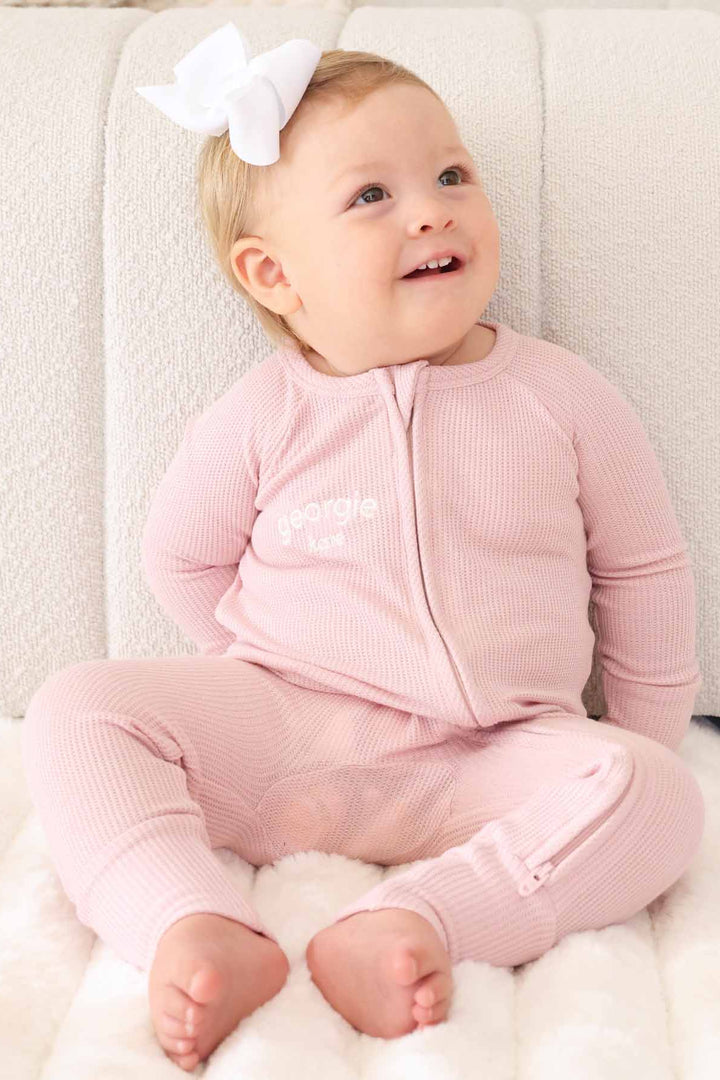 light pink zip romper pajama for girls embroidered with name 