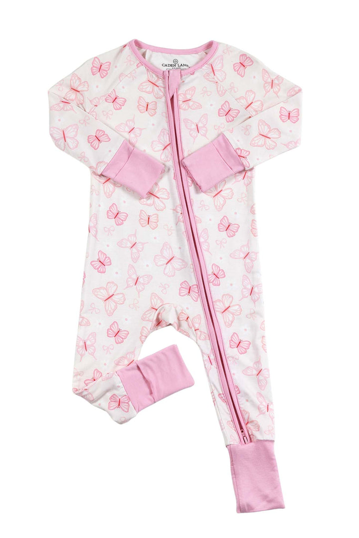 Convertible Zip Romper in Blooming Butterflies print - flat lay product shot showing the full romper with double zipper, pink cuffed wrists and ankles, and butterfly print on white