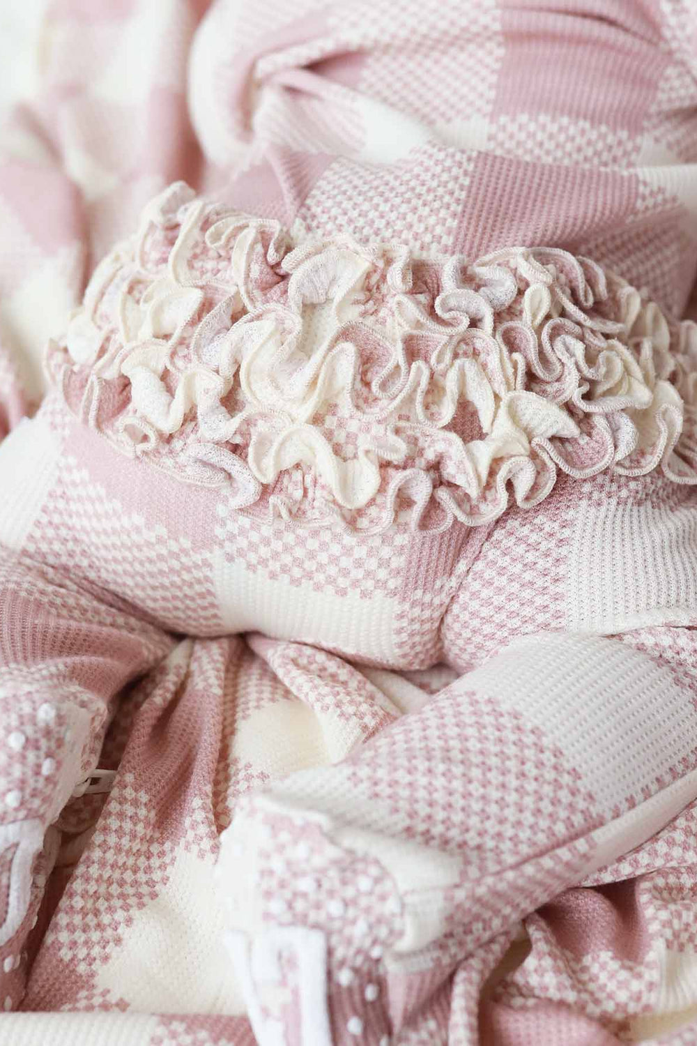 bamboo waffle ruffle butt footie for babies pink check 