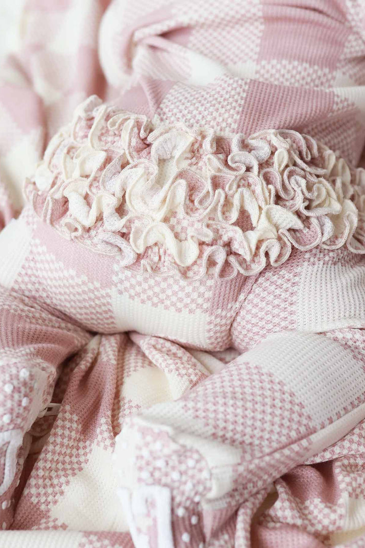 bamboo waffle ruffle butt footie for babies pink check 