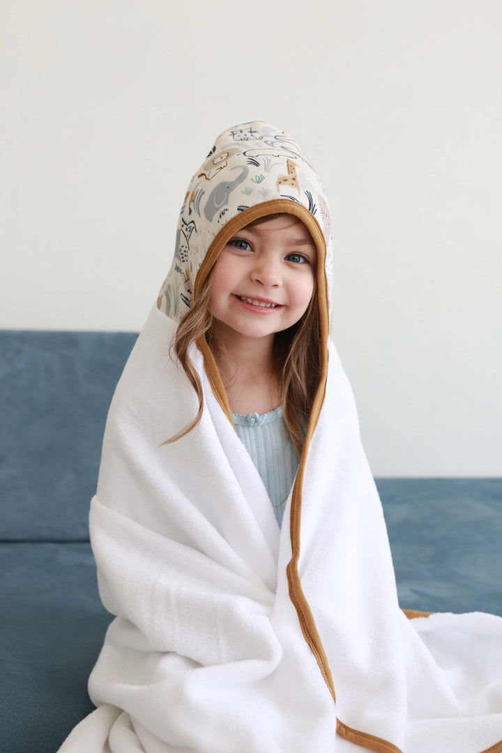 girl wrapped in into the wild hooded towel