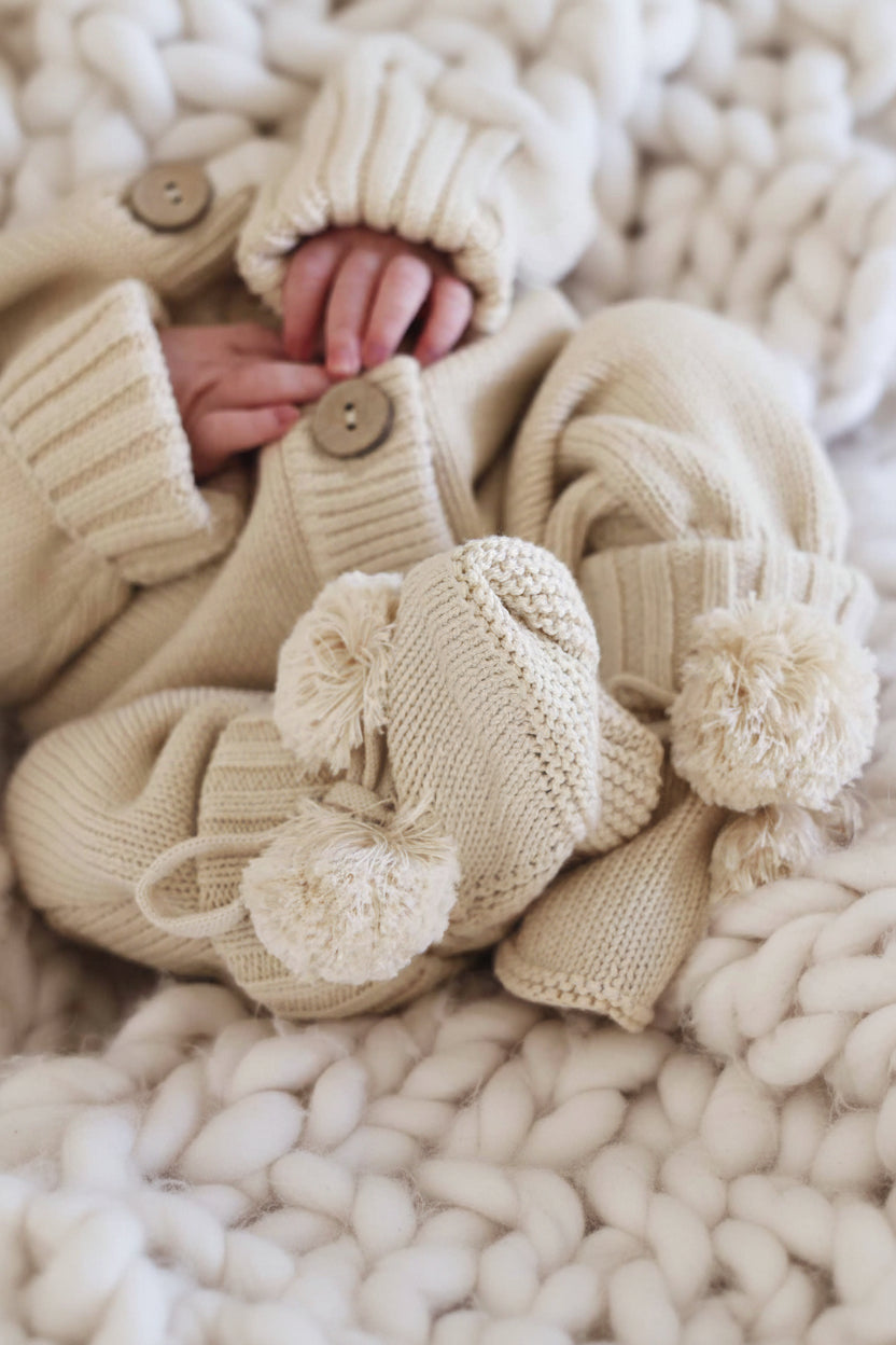 tan pom pom sweater booties for babies
