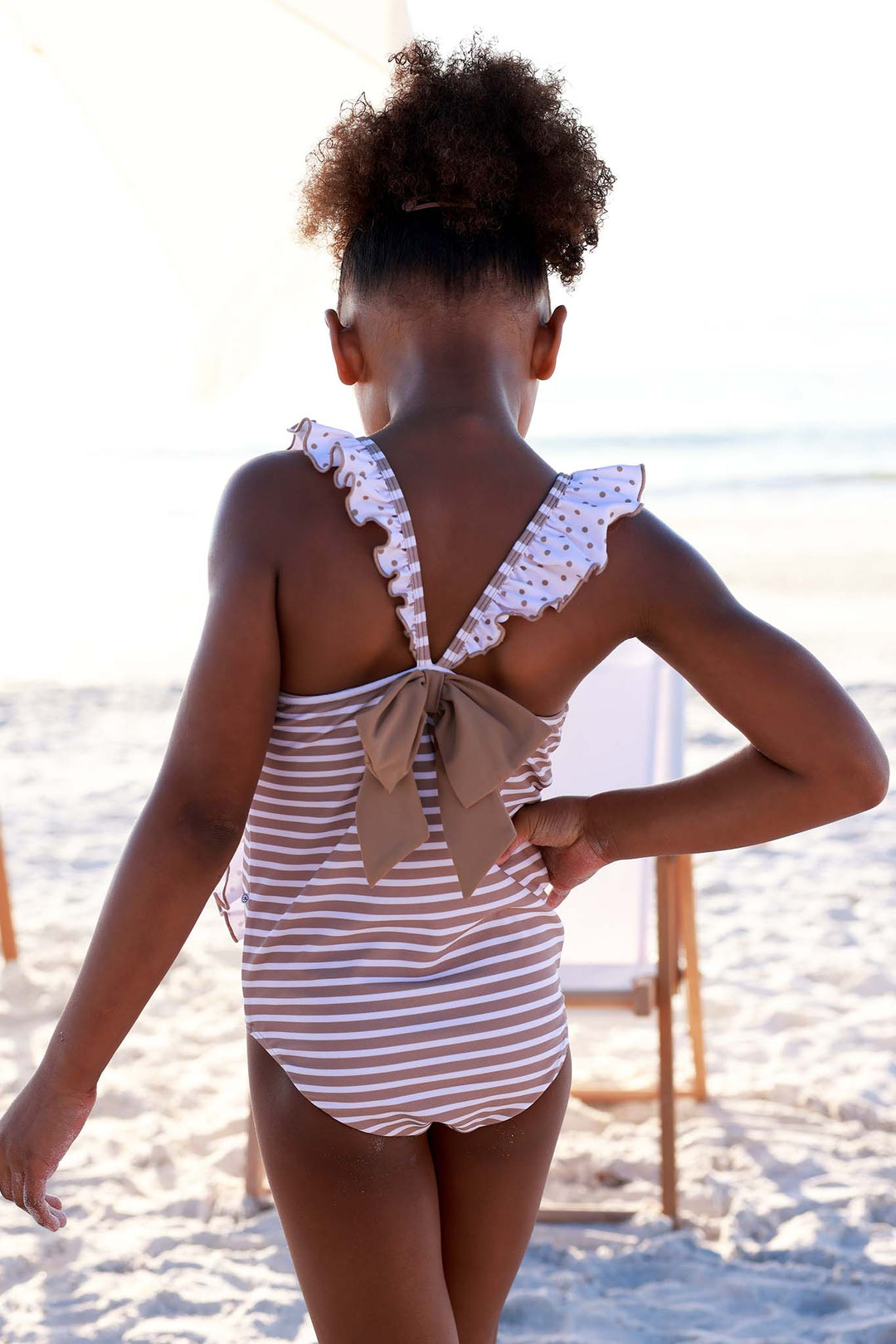 back view of double ruffle one piece swimsuit in sandy stripes print 