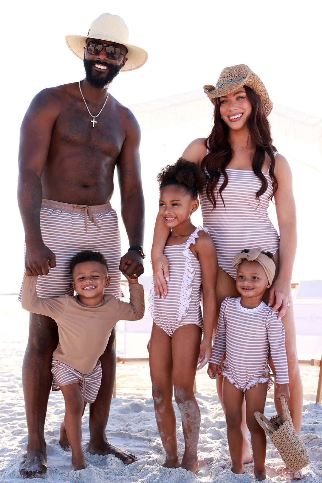 neutral stripe and polka dot family matching swimsuits for parents and kids 