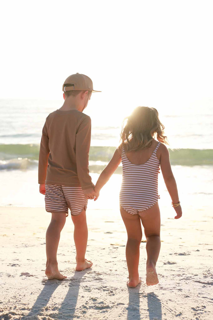 sibling matching striped swimsuits 