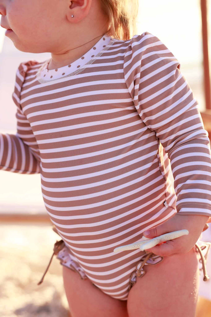 sandy stripes ruffle bottom rash guard romper for baby and toddler girls 