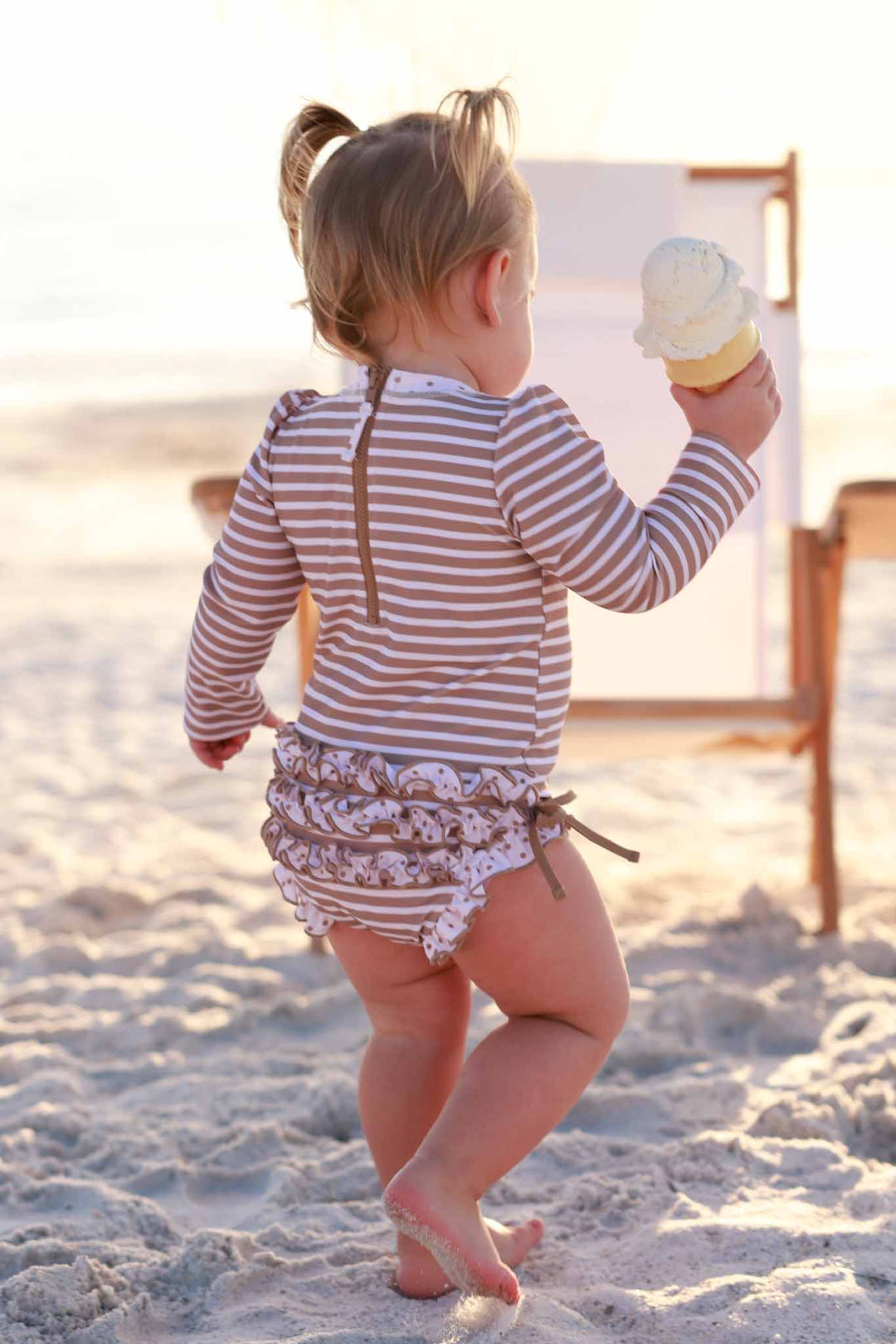 sandy stripes ruffle bottom rash guard 