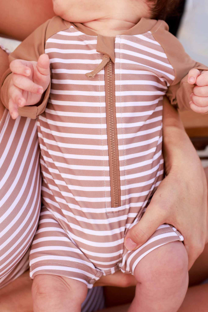 closeup of sandy stripes shorty romper for babies 