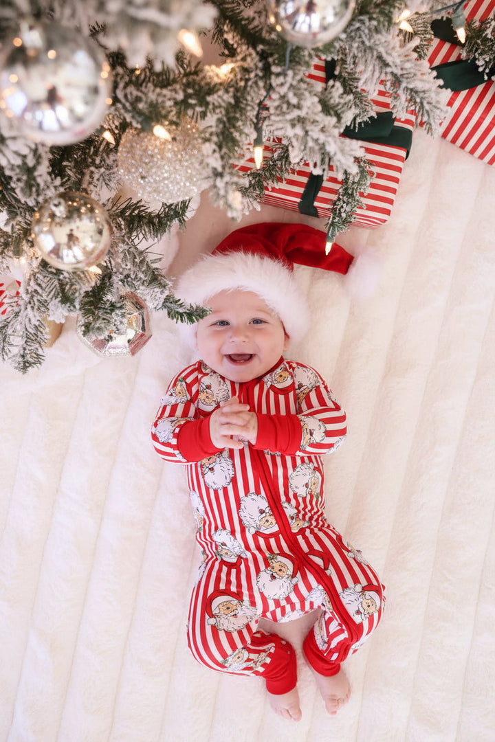 Baby in red and white Caden Lane stripped Santa claus lane romper