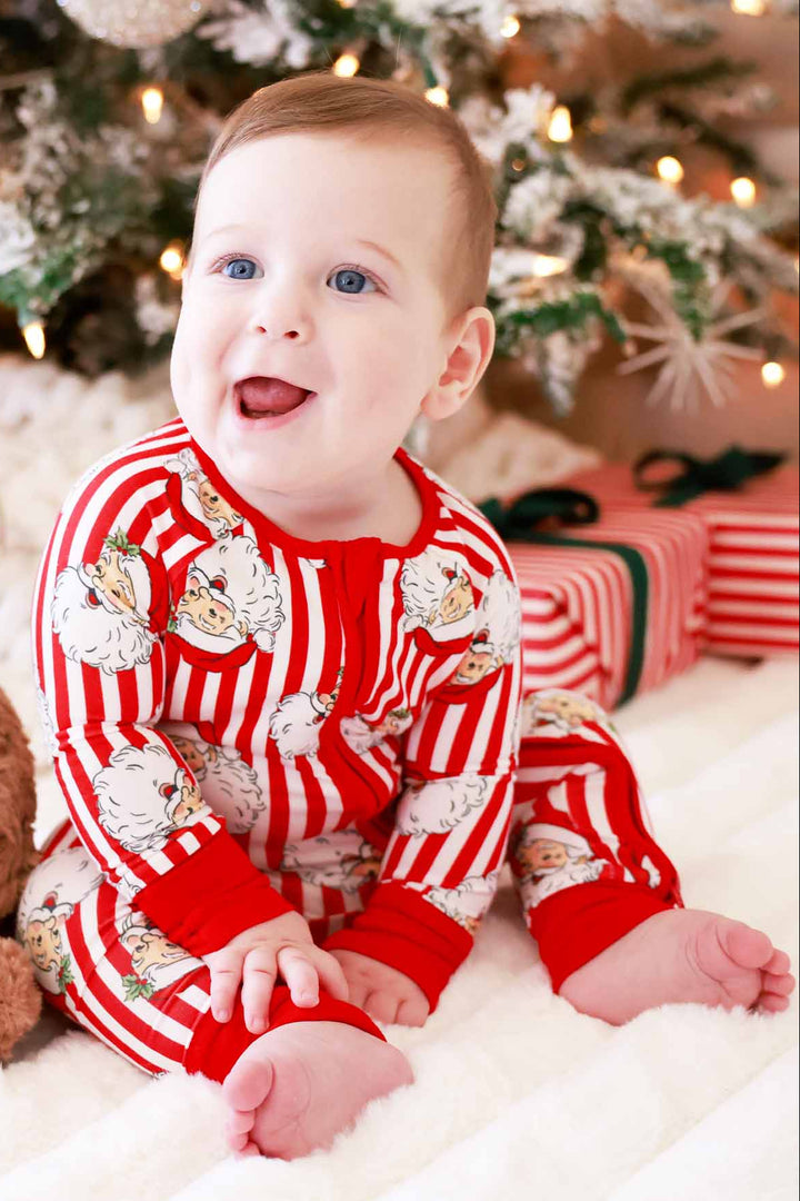 Baby in red and white Caden Lane stripped Santa claus lane romper