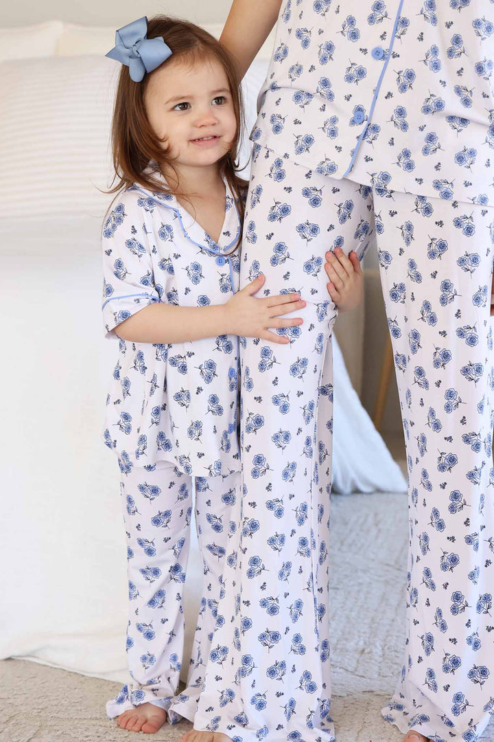 daughter holding mom's leg wearing matching sapphire garden flare lounge sets 