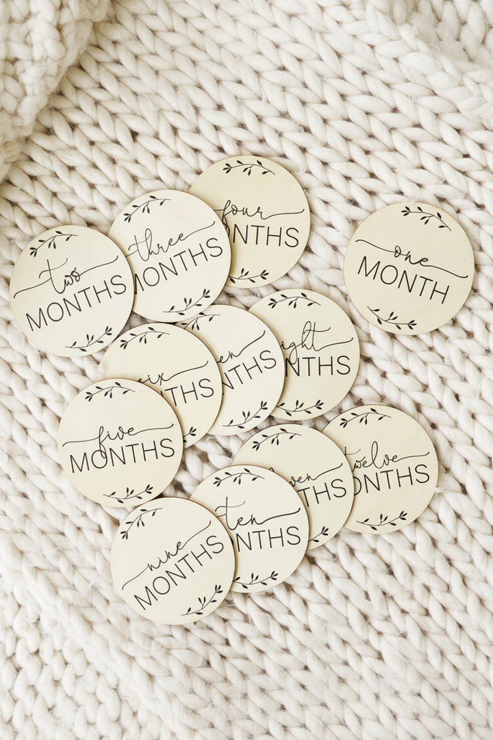 monthly milestone baby photo prop with leaves 