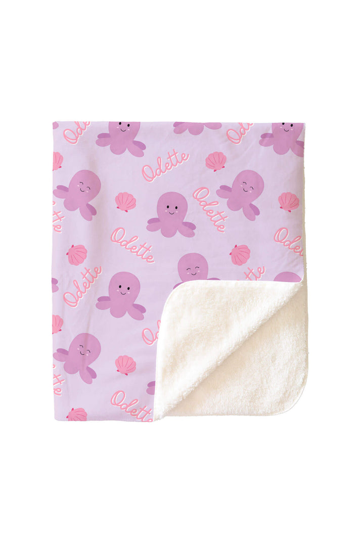 personalized sea snuggles kids blanket with corner folded to reveal soft white sherpa reverse side