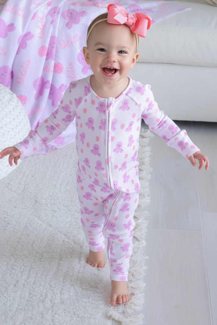 baby walking on white rug in sea snuggles bamboo waffle convertible zip romper — full body lifestyle shot
