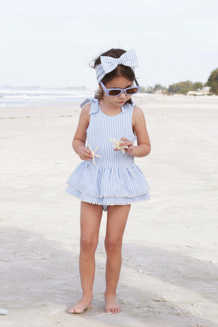 tiered skirt with white pom pom trim seersucker blue 
