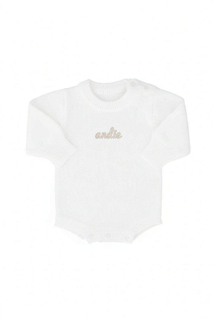 white embroidered knit bubble romper with script font 