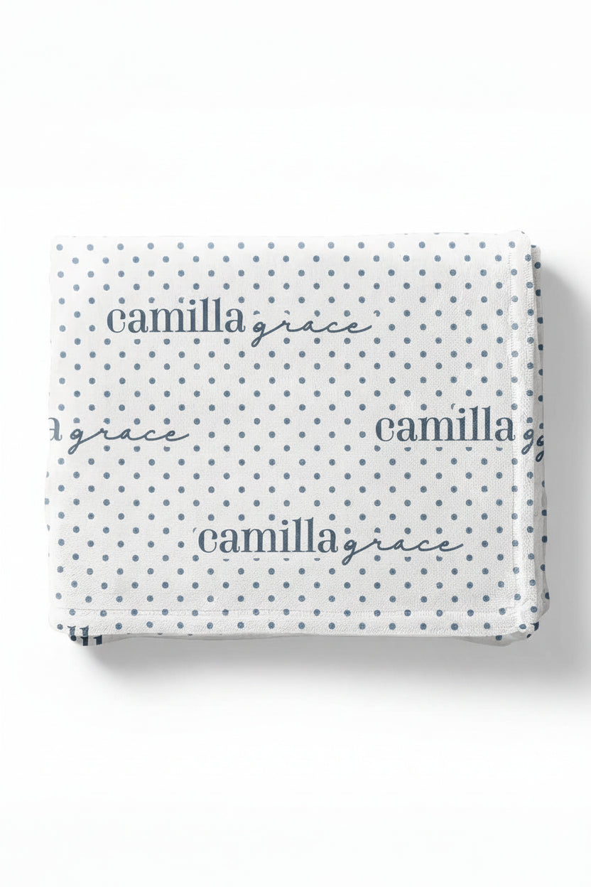 white winky blanket for kids with blue polka dots that is personalized with kids name 